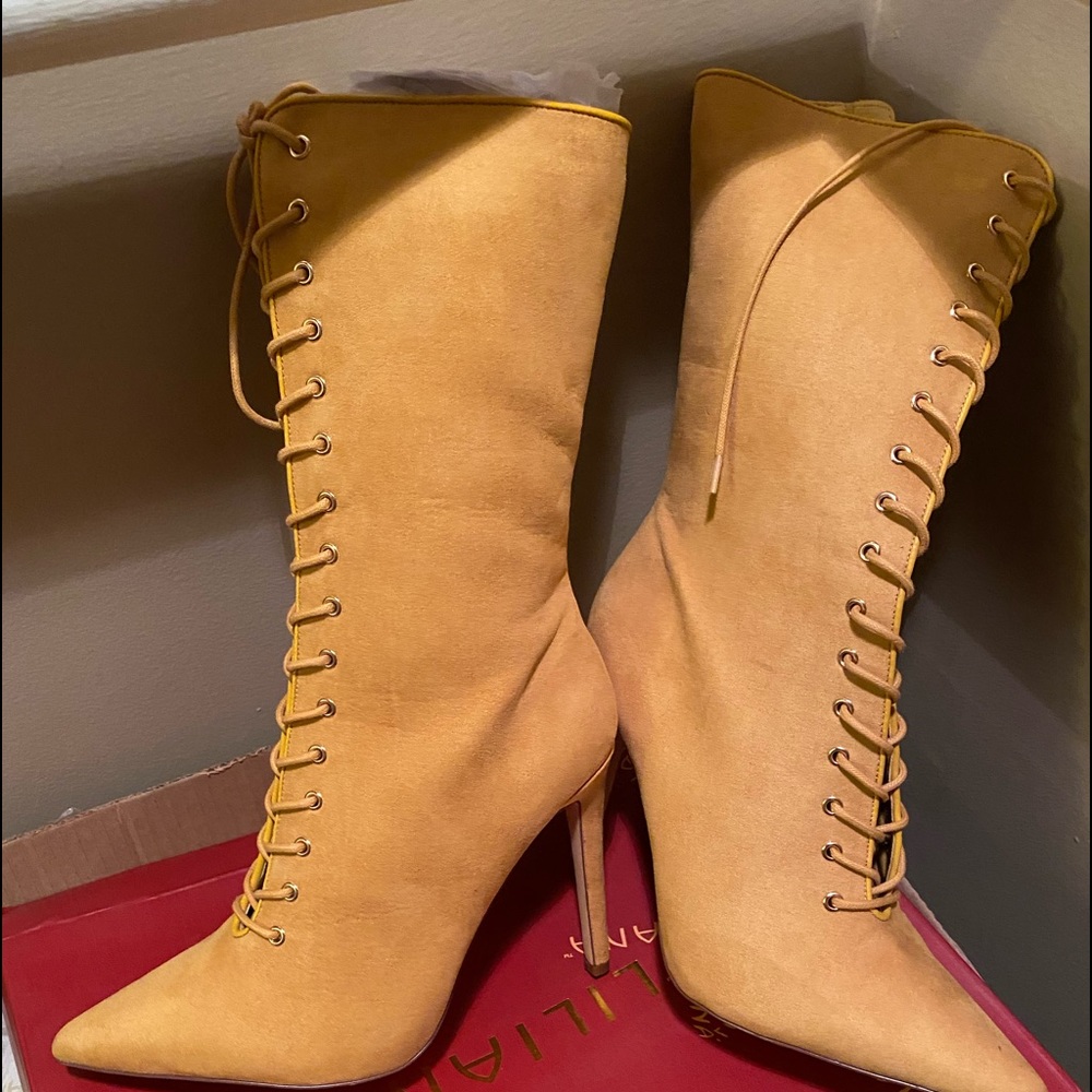 Yellowish color. mid calf. FITS LIKE A 9-9.5